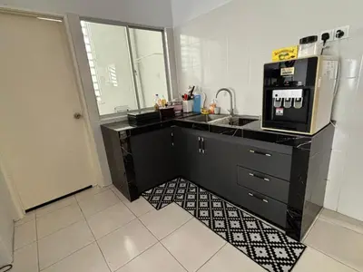 a kitchen with a sink and a microwave at HS homestay Casa Klebang Ipoh in Ipoh