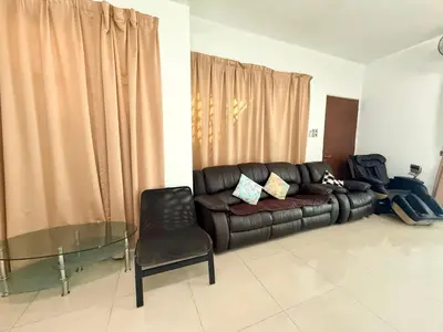 a living room with a leather couch and a glass table at 7BR Penang Stay Near Gurney and George Town in Tanjong Tokong