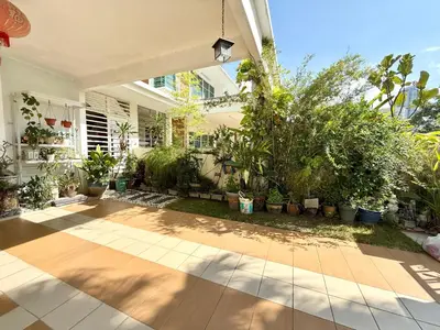 a courtyard of a house with potted plants at 7BR Penang Stay Near Gurney and George Town in Tanjong Tokong