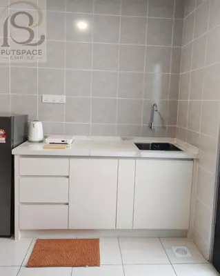 a white kitchen with a sink and a refrigerator at Putspace Empire-Bandar Baru Putra, Ipoh Perak in Ipoh