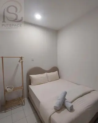 a bedroom with a bed with a pillow on it at Putspace Empire-Bandar Baru Putra, Ipoh Perak in Ipoh