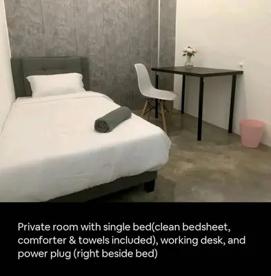 a bedroom with a bed with a desk and a chair at Bukit Mertajam 1 pax Salesman 5pm to 8am Room in Bukit Mertajam