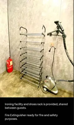 a fire extinguisher in the corner of a room at Bukit Mertajam 1 pax Salesman 5pm to 8am Room in Bukit Mertajam