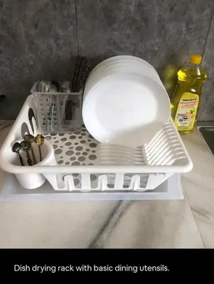 a white dish drying rack with basic dining utensils at Bukit Mertajam 1 pax Salesman 5pm to 8am Room in Bukit Mertajam