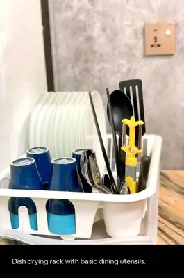 a dish drying rack with basic dining utensils at Bukit Mertajam 1 pax Salesman 5pm to 8am Room in Bukit Mertajam