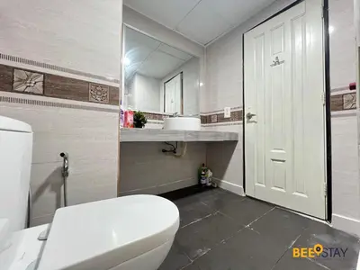 a bathroom with a white toilet and a mirror at Kelip2 Hill View Cameron 5 min to Kea Farm in Brinchang