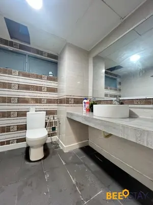a bathroom with a white toilet and a sink at Kelip2 Hill View Cameron 5 min to Kea Farm in Brinchang