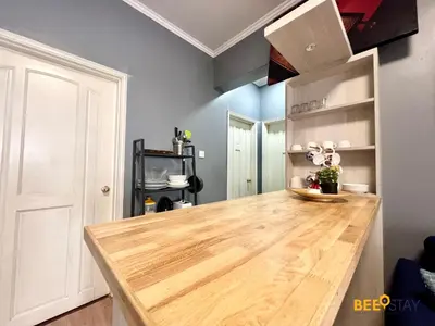 a kitchen with a wooden counter top in a room at Kelip2 Hill View Cameron 5 min to Kea Farm in Brinchang