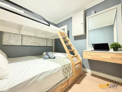 a bedroom with a bunk bed with a laptop on it at Kelip2 Hill View Cameron 5 min to Kea Farm in Brinchang