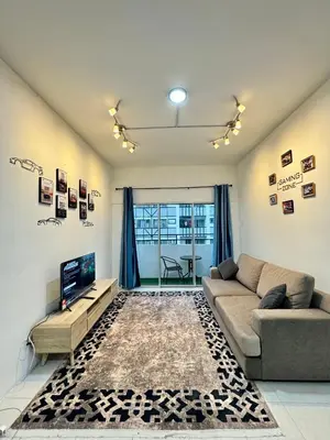 a living room with a couch and a tv at AYAAN Gamer's Pitstop at Tanah Rata Cameron Highland in Tanah Rata