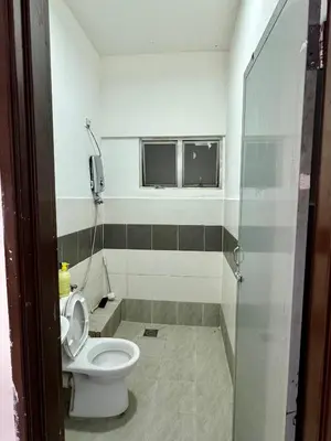 a bathroom with a toilet and a window at AYAAN Gamer's Pitstop at Tanah Rata Cameron Highland in Tanah Rata