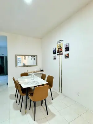 a dining room with a table and chairs at AYAAN Gamer's Pitstop at Tanah Rata Cameron Highland in Tanah Rata