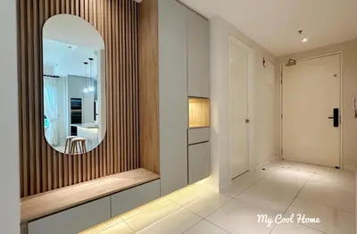 a hallway with a mirror and a dressing room at Onsen Suite Theme Park View in Ipoh
