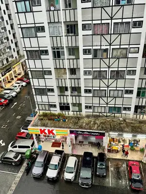 a parking lot with cars parked in front of a building at AYAAN Highland Escape with PS4 gaming and Netflix at Cameron Highland in Tanah Rata