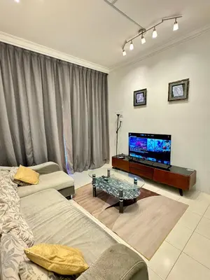 a living room with a couch and a flat screen tv at AYAAN Highland Escape with PS4 gaming and Netflix at Cameron Highland in Tanah Rata
