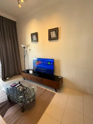a living room with a tv and a coffee table at AYAAN Highland Escape with PS4 gaming and Netflix at Cameron Highland in Tanah Rata