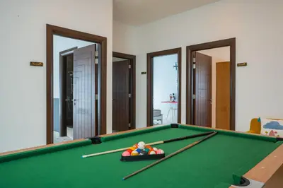 a room with a pool table with chopsticks on it at Cheekaaboo Playhouse Ipoh I Private Pool Family Stay with Indoor Playzone in Ipoh