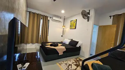 a bedroom with a bed in a room at Batu Puteh Chalet by the River, Pool, WIFI