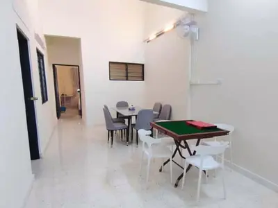 a dining room with a table and chairs at Ipoh Tambun Field - Landed House 9px - 3R2B in Ipoh