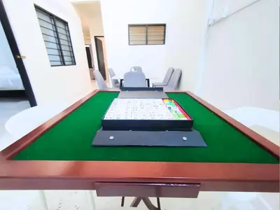 a pool table in a living room with at Ipoh Tambun Field - Landed House 9px - 3R2B in Ipoh