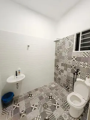 a bathroom with a toilet and a sink at Private Roomstay Shared Home Near KTM Batu Gajah in Batu Gajah