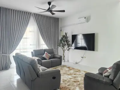 a living room with two couches and a ceiling fan at Private Roomstay Shared Home Near KTM Batu Gajah in Batu Gajah