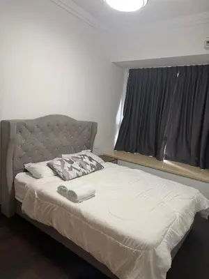a large bed in a room with a window at R&F Seine Region in Gua Sai