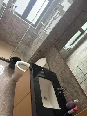 a bathroom with a sink and a toilet at R&F Seine Region in Gua Sai