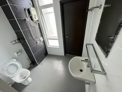 a bathroom with a sink and a toilet and a mirror at Majestic Condo Top Floor 2room Smart TV & WiFi in Ipoh