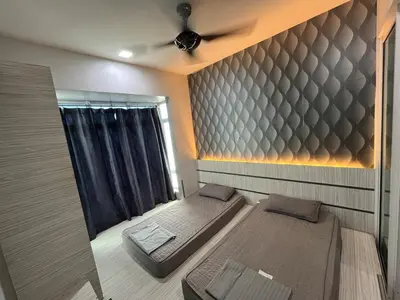 a room with two beds and a window at Majestic Condo Top Floor 2room Smart TV & WiFi in Ipoh