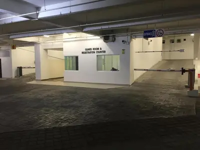 an empty parking garage with a sign that says buy not a security center at Majestic Condo Top Floor 2room Smart TV & WiFi in Ipoh