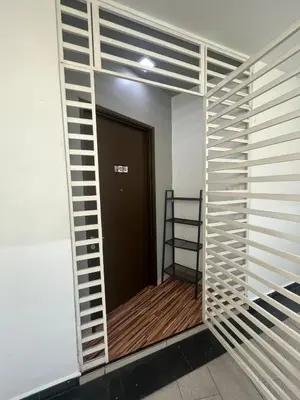 a room with a door and a ladder on a wall at Majestic Condo Top Floor 2room Smart TV & WiFi in Ipoh