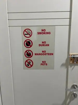 a sign on the door of a bathroom withhibited signs at Homestay Kesidang in Seri Iskandar
