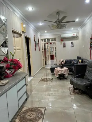 a living room with couches and a ceiling at Taman Gerik Homestay in Gerik