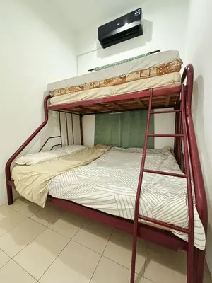a bedroom with two bunk beds in a room at Ipoh Pengkalan Homestay in Ipoh