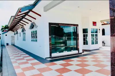 a large white building with a checkered floor at Taiping Nest Homestay 3BR, 7Pax, WiFi, Private Parking, Comfy in Taiping