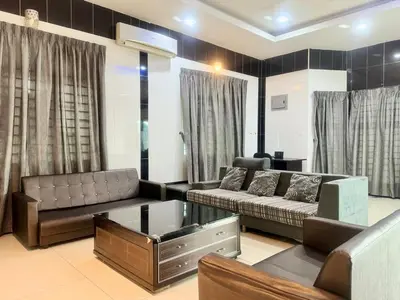 a living room with a couch and a table at Taiping Nest Homestay 3BR, 7Pax, WiFi, Private Parking, Comfy in Taiping