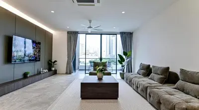 a living room with a couch and a table at Modern Luxury Villa Hinai by Simple Sanctuary in George Town