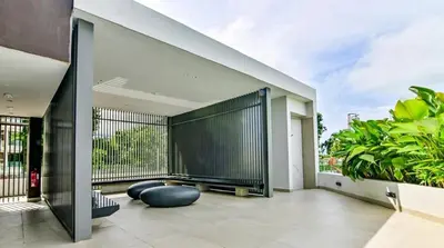 a balcony with a black fence and some plants at Modern Luxury Villa Hinai by Simple Sanctuary in George Town