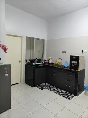 a kitchen with a black counter and a refrigerator at HS Homestay Casa Klebang Ipoh in Chemor
