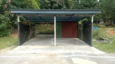 a shelter in the middle of a parking lot at QAUSAR HOMESTAY KERLING Hulu Selangor in Kerling