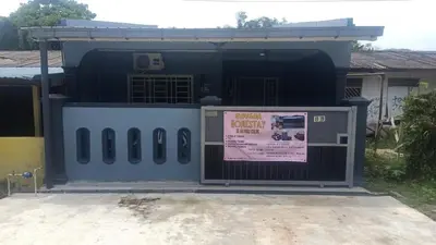 a building with a sign in front of it at QAUSAR HOMESTAY KERLING Hulu Selangor in Kerling