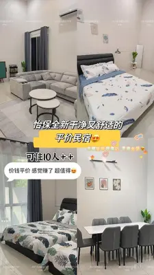 a room with a bed and a couch and a table at JW HomeStay IPOH in Ipoh