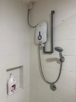 a shower in a bathroom with a soap dispenser at Studio Unit Trefoil Setia Alam in Gua Sai
