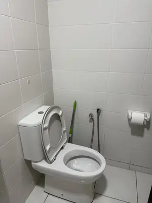 a bathroom with a toilet with the seat up at Studio Unit Trefoil Setia Alam in Gua Sai