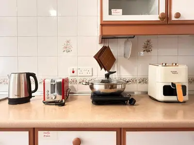a kitchen counter with a pot on a stove at Equatorial Hill Resort, Mountain view In Cameron Highlands in Brinchang