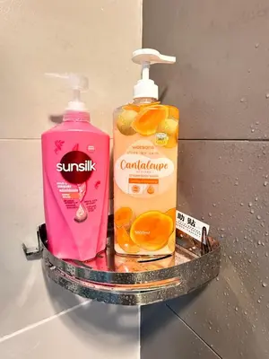 a shelf with a bottle of soap and oranges on it at Equatorial Hill Resort, Mountain view In Cameron Highlands in Brinchang