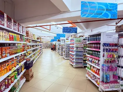 a store aisle of a grocery store with lots of products at Equatorial Hill Resort, Mountain view In Cameron Highlands in Brinchang
