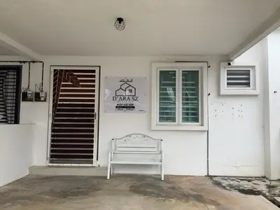 a white house with a bench next to a window at D' Ara SZ Homestay in Kubang Semang