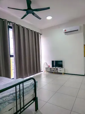 a bedroom with a bed and a ceiling fan at Spacious Luxury Home 3BR 2BA 14pax in George Town